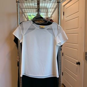 White top with geometric cut-out appearance